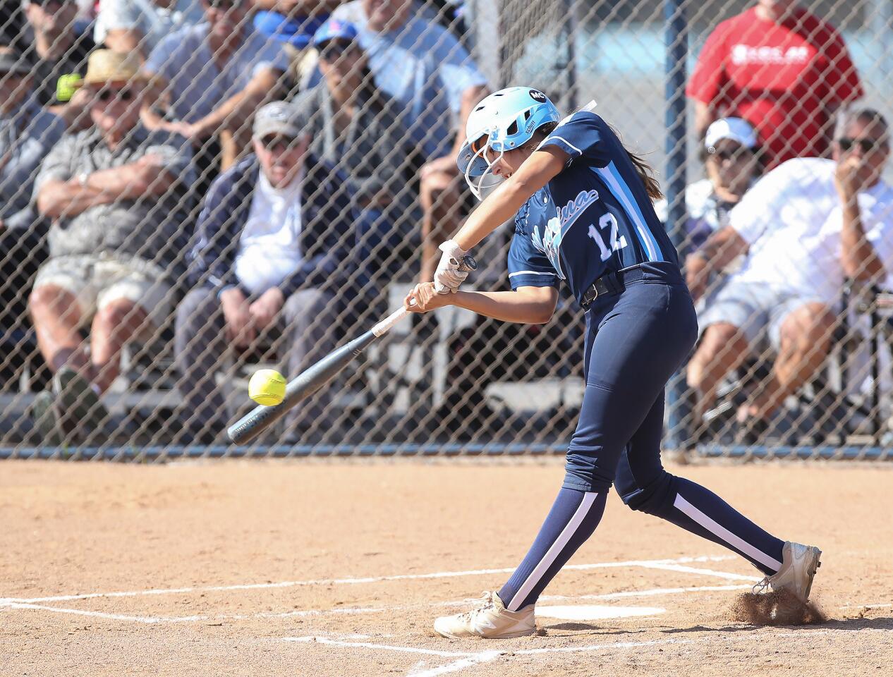 Briana Gonzalez singles to left field in Marina High's Surf League home game against Los Alamitos on Tuesday.