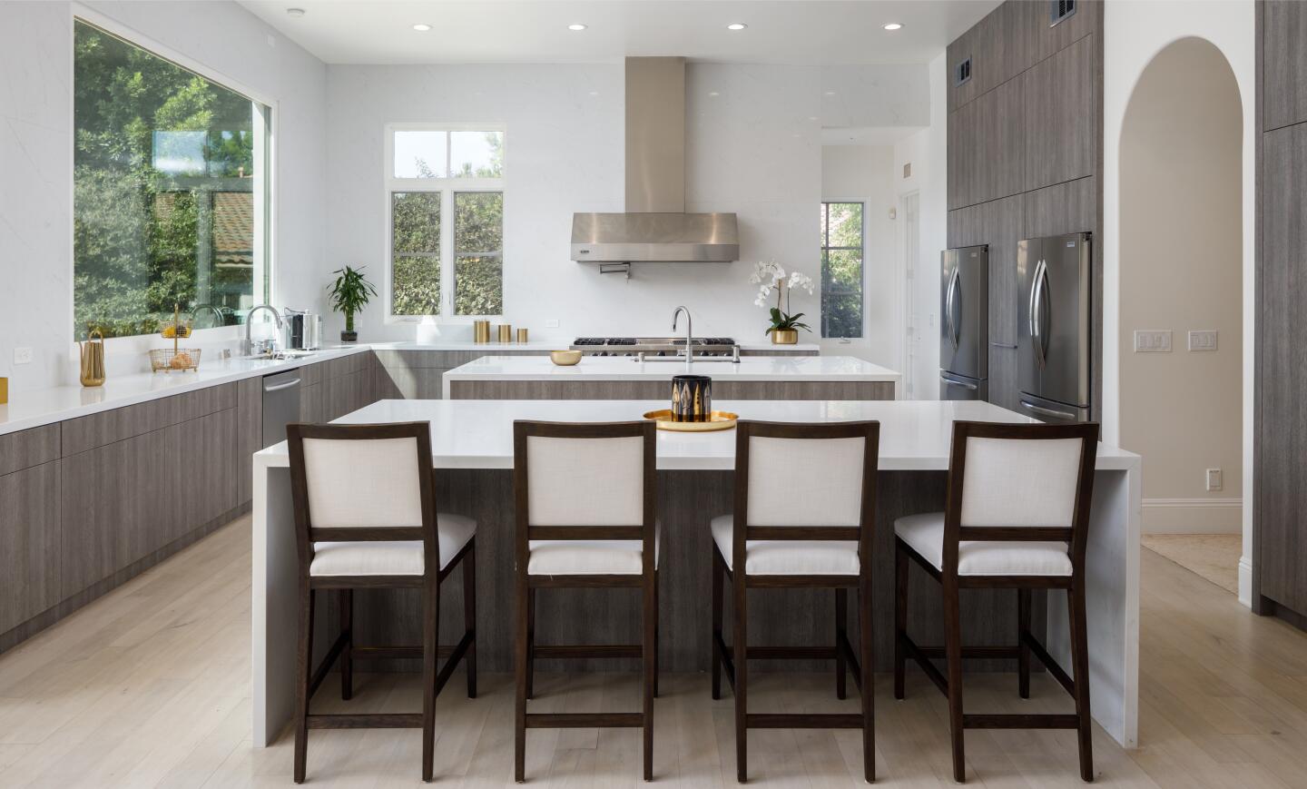 Seating for four at one of two kitchen islands.