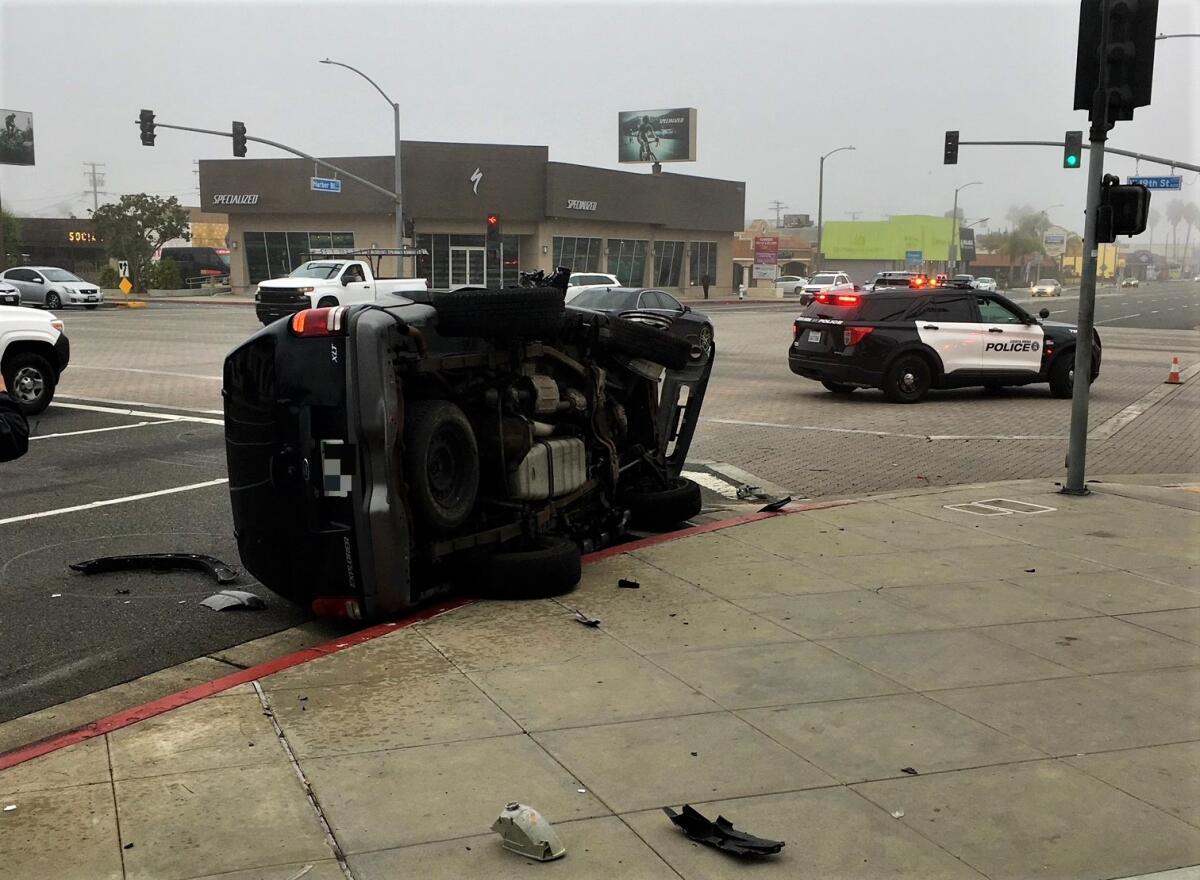A rollover collision Friday morning at Harbor Boulevard and 19th Street in Costa Mesa. 