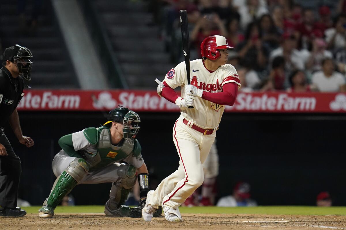 Angels' Shohei Ohtani watches his groundout.