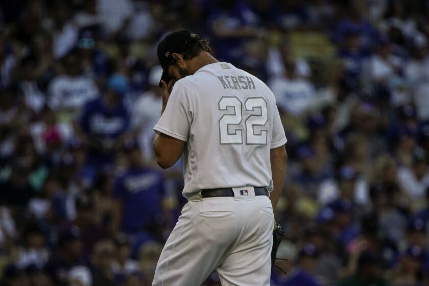 LOS ANGELES, CALIF. - AUGUST 25: Los Angeles Dodgers starting pitcher Clayton Kershaw (22) walks off the field at the end of an inning during a Major League Baseball game against the New York Yankees at Dodger Stadium on Sunday, Aug. 25, 2019 in Los Angeles, Calif. (Kent Nishimura / Los Angeles Times)