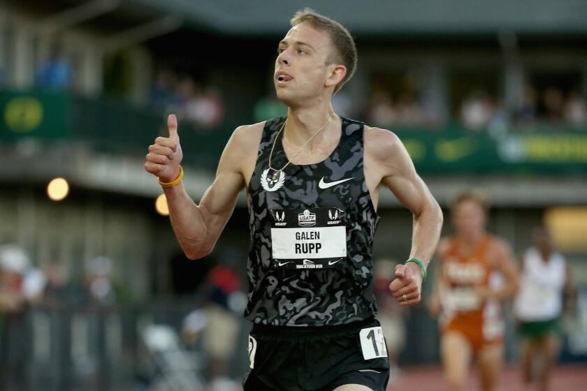 Galen Rupp celebrates winning the 10,000 meters Thursday at the U.S. track and field championships in Eugene, Ore.