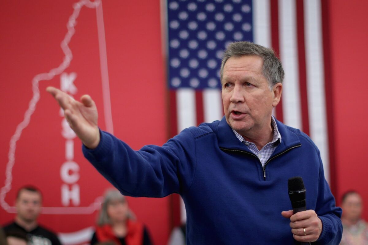 Republican presidential candidate and Ohio Gov. John Kasich campaigns in Bow, N.H.