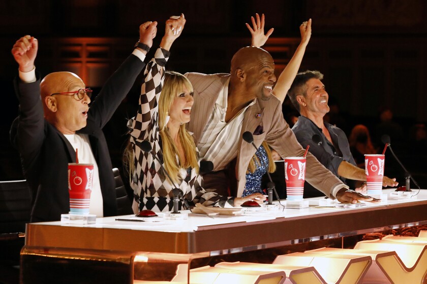 Howie Mandel, left, Heidi Klum, Terry Crews and Simon Cowell at the judges table on "America’s Got Talent."