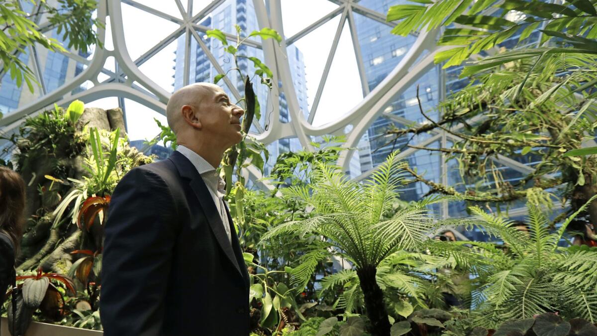 Jeff Bezos, the CEO and founder of Amazon, takes a walking tour of the Amazon Spheres in Seattle.