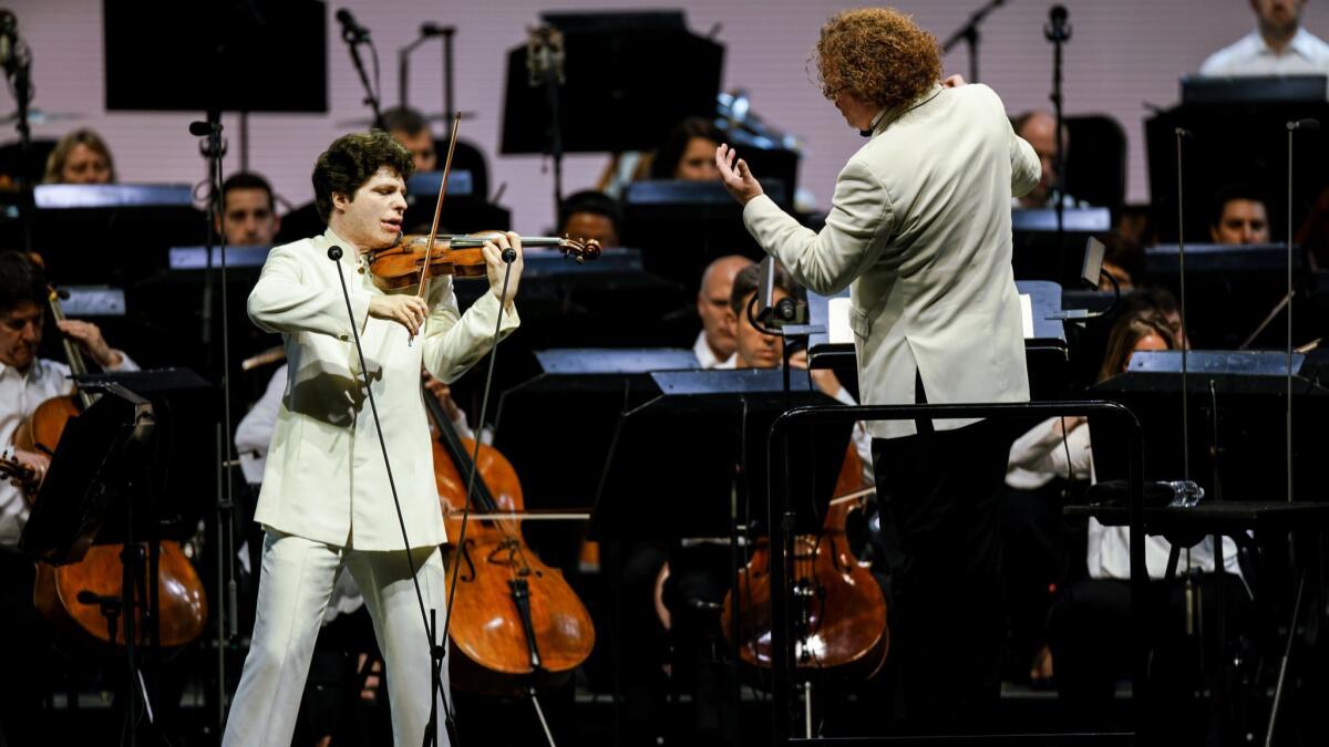 Violinist Augustin Hadelich performs as Stéphane Denève conducts the Los Angeles Philharmonic.