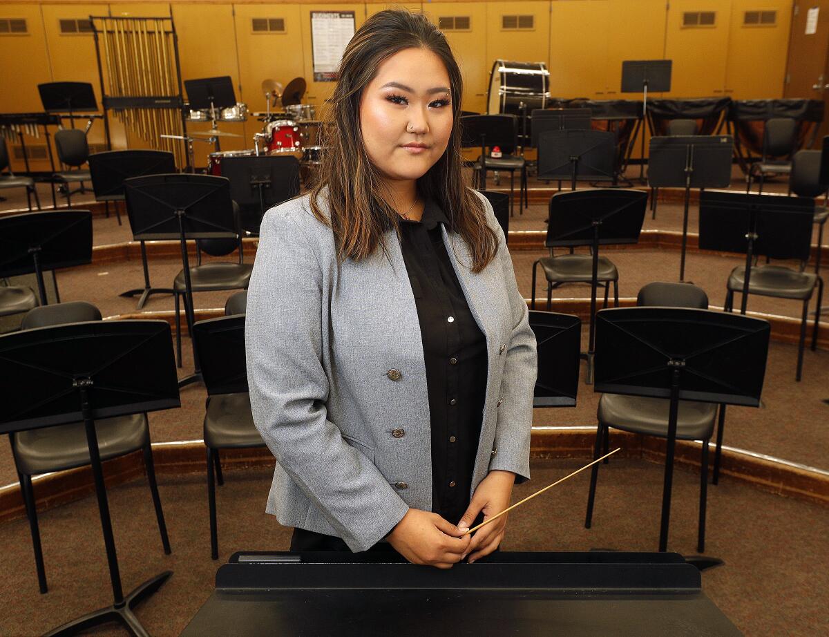 Glendale High School senior Elizabeth Kim, in the large music room at Glendale High School, was one of three local students selected for the Discovery Conductors mentorship program through the Burbank Philharmonic Orchestra. Kim will take part in master classes and will guest conduct philharmonic on its opening night.