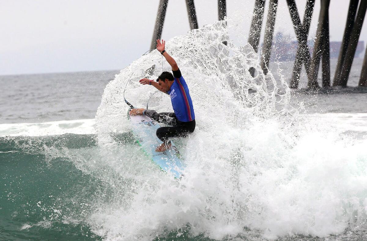 Griffin Colapinto gets some spray while doing a cutback during the final heat of the U.S. Open of Surfing.