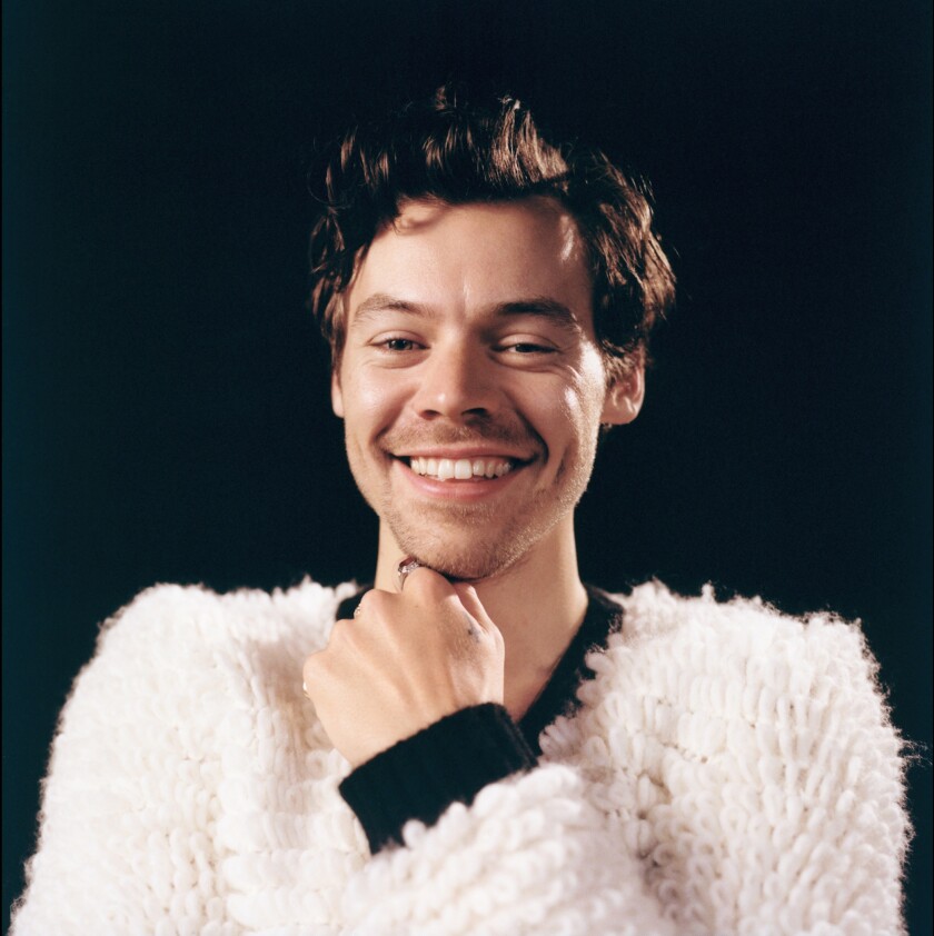 A man in a white fluffy shirt