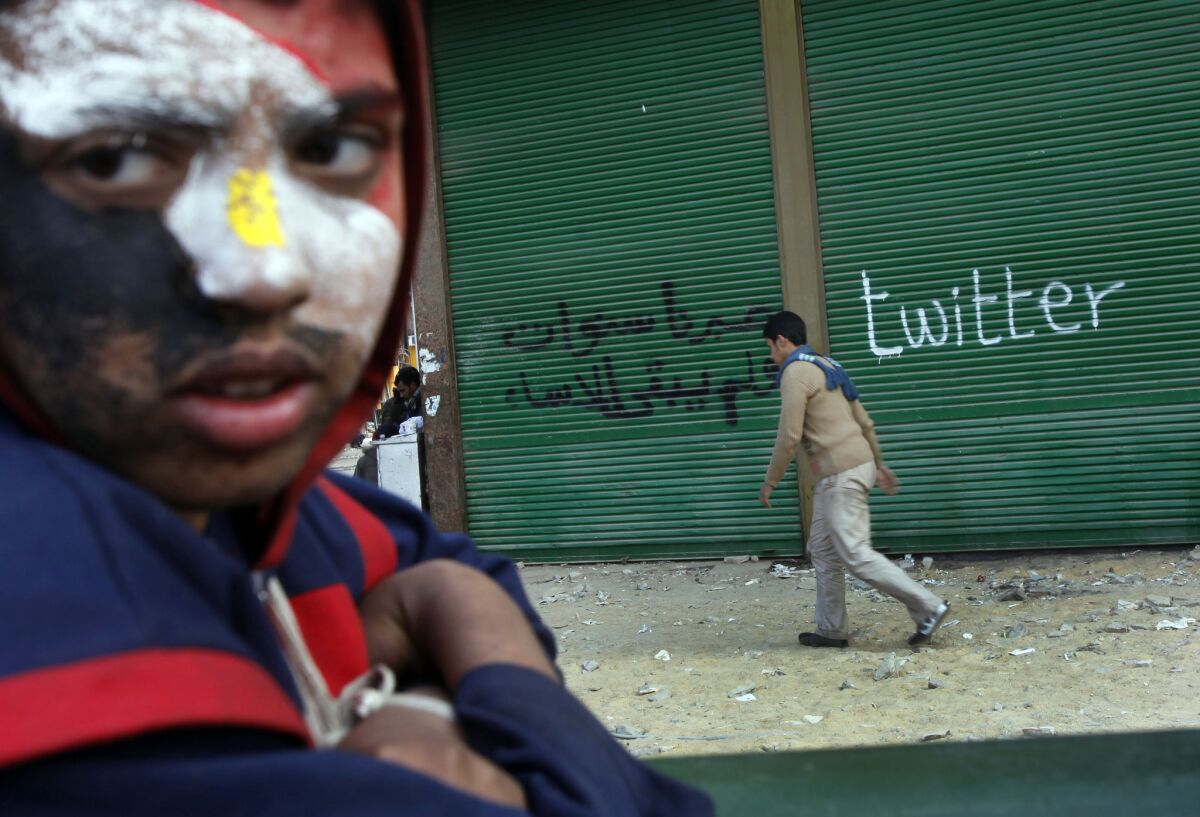 A protester at Cairo's Tahrir Square takes part in demonstrations in 2011, when Egyptians used social media to help overthrow autocratic President Hosni Mubarak.