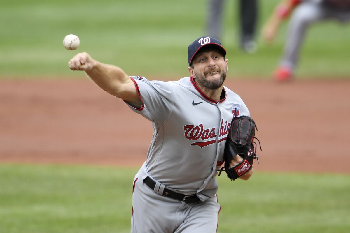 Washington Nationals starting pitcher Max Scherzer delivers a pitch during the first inning of a baseball game against the Baltimore Orioles, Sunday, Aug. 16, 2020, in Baltimore. (AP Photo/Nick Wass)