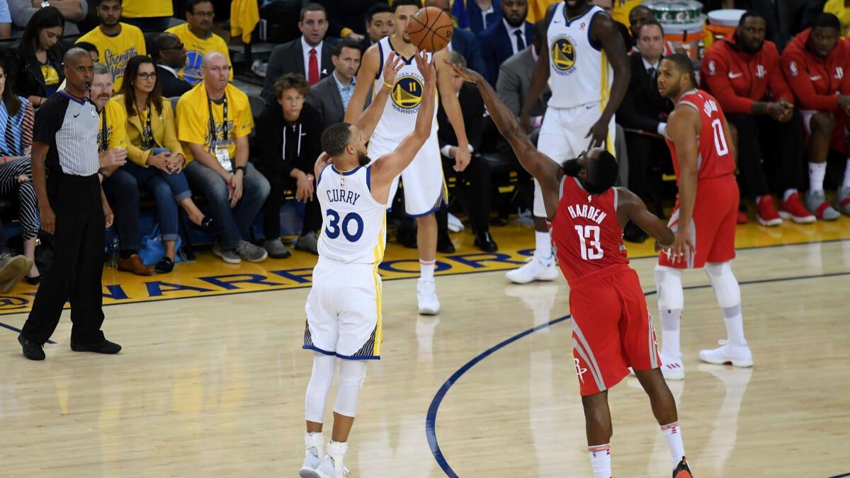 Stephen Curry drains a three against James Harden during Game 3.