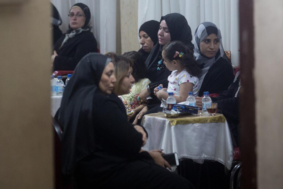 Friends and relatives attend a memorial service for EgyptAir pilot Mohamed Saeed Shokair on May 22, 2016, in Cairo.