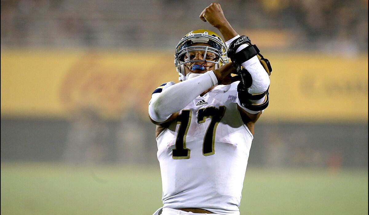 UCLA quarterback Brett Hundley celebrates after scoring against Arizona State on a diving one-yard touchdown run in the fourth quarter.