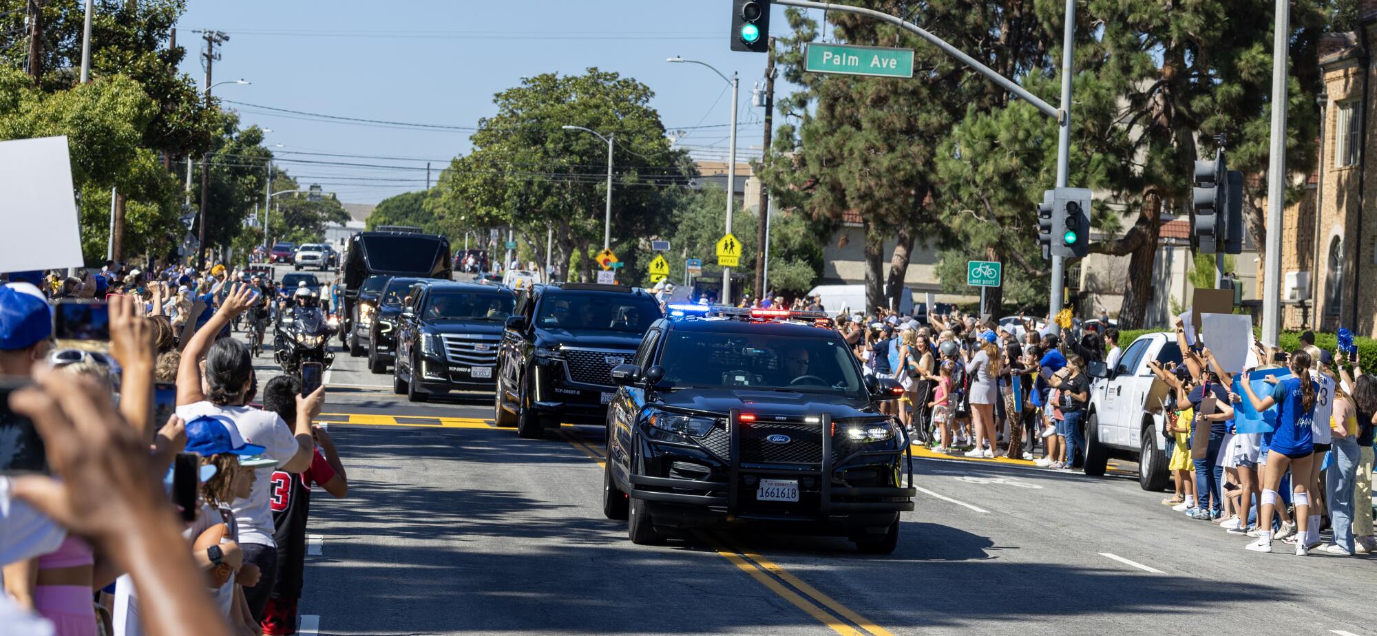 Hundreds of El Segundo community members line Main Street.