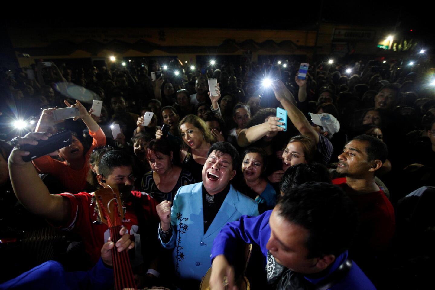 Fans perform songs from iconic Mexican singer and song writer Juan Gabriel outside his house after his death, in Ciudad Juarez, Mexico, August 28, 2016.