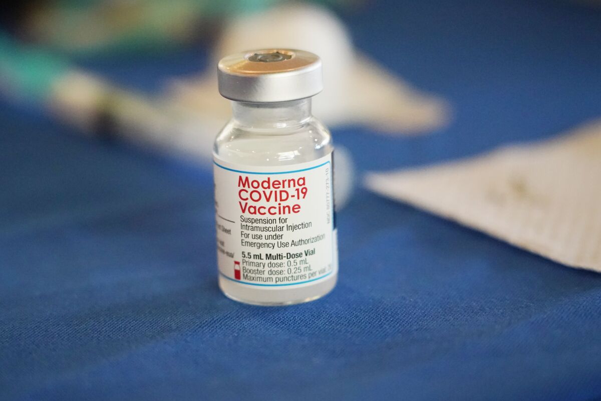 FILE - A vial of Moderna COVID-19 vaccine rests on a table at an inoculation station next to Jackson State University in Jackson, Miss., on July 19, 2022. British health authorities have authorized an updated version of Moderna's coronavirus vaccine that aims to protect against the original virus and the omicron variant. (AP Photo/Rogelio V. Solis)