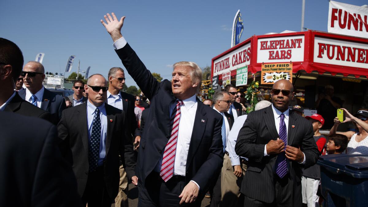 Donald Trump waves during a visit to the Canfield Fair in Canfield, Ohio, on Monday.