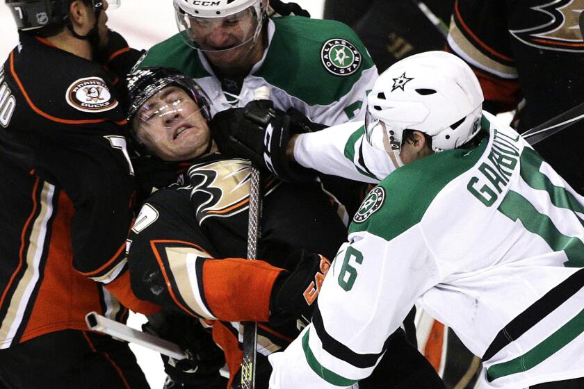 Ryan Garbutt, right, tangles with the Ducks' Stephane Robidas, center, during the second period of a playoff game in 2014.