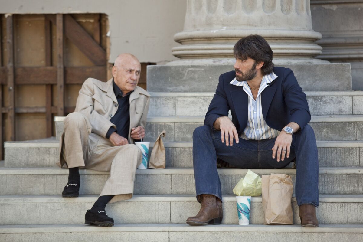 Alan Arkin, left, as studio boss Lester Siegel and Ben Affleck as Tony Mendez in the 2012 film "Argo