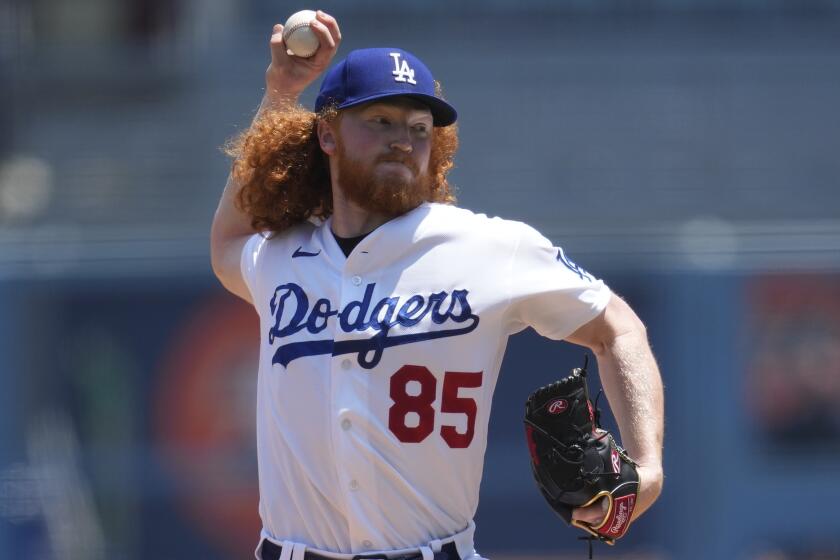 Los Angeles Dodgers starting pitcher Dustin May (85) throws during the first inning.