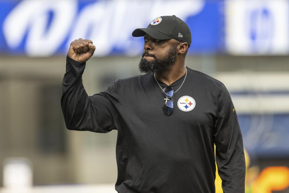 Pittsburgh Steelers head coach Mike Tomlin gestures from the sideline.