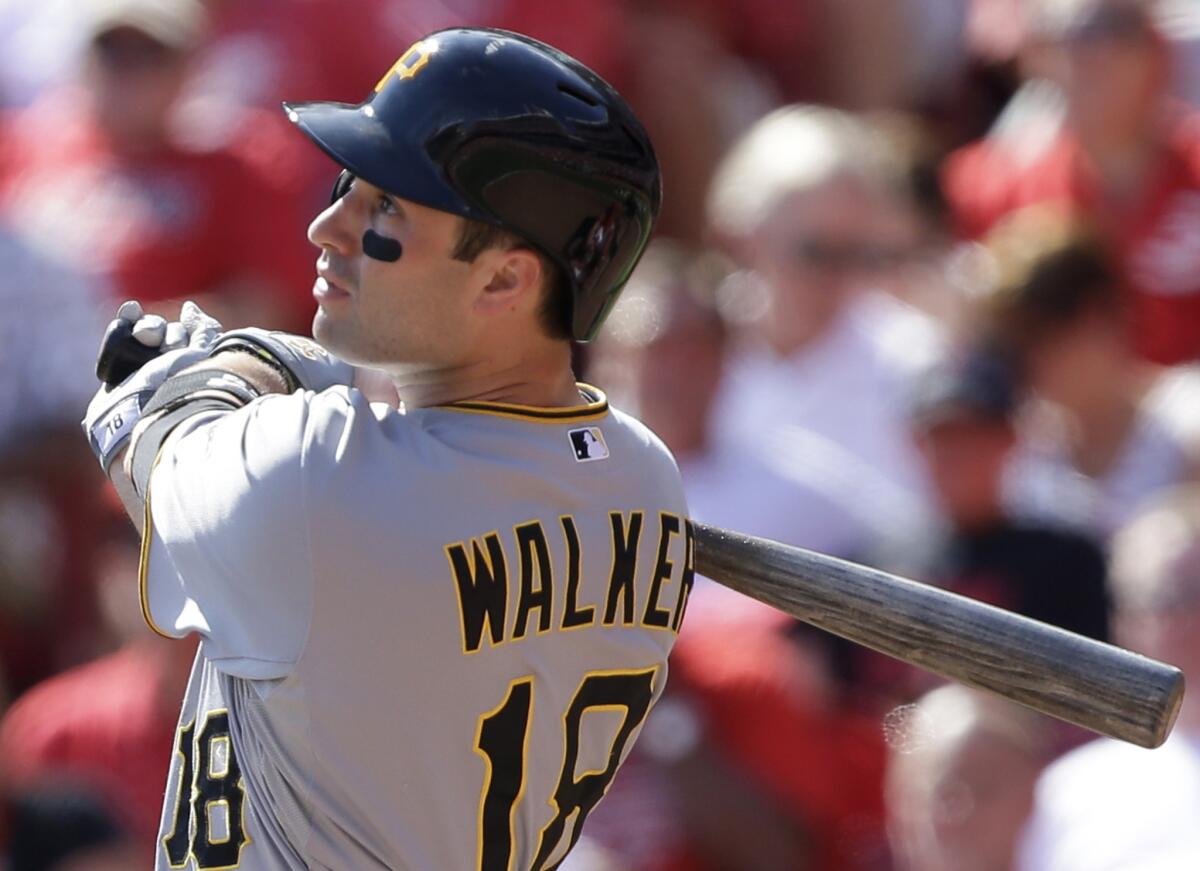 Pirates second baseman Neil Walker hits a solo home run off in 2013.