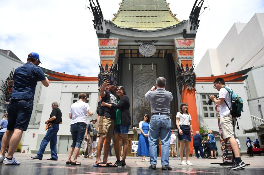 Tourists visit the TCL Chinese Theatre IMAX in Hollywood.