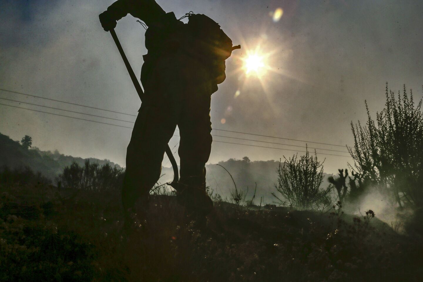Fire crews are busy mopping up hot spots from the Blue Cut fire on Highway 2 on the way to Wrightwood.