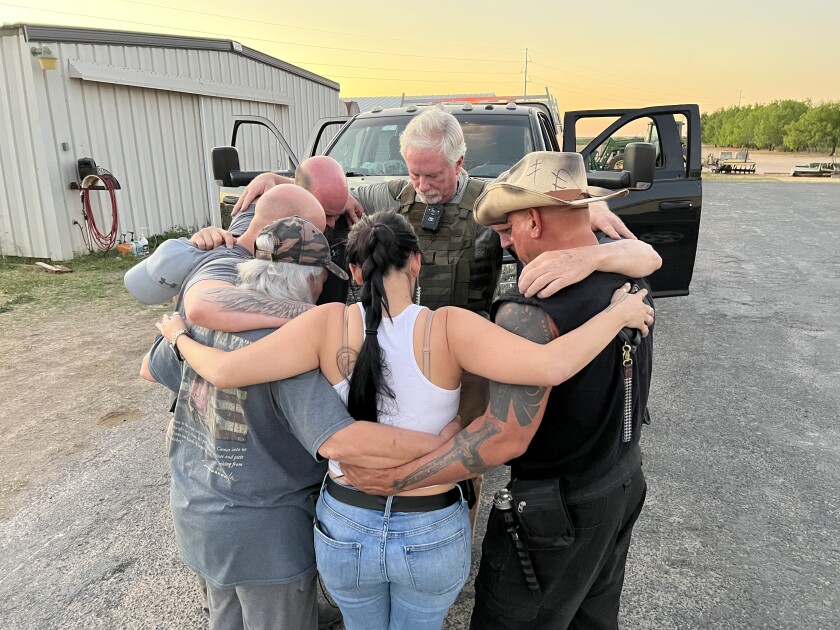 Patriots for America militia members prayed last month before patrolling the Texas border.