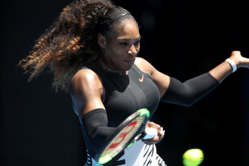 Serena Williams returns a shot against Belinda Bencic during their first-round match at the Australian Open on Tuesday.