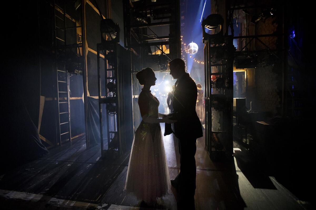 Cinderella (Ashley Shaw) The pilot (Edwin Ray) wait backstage.