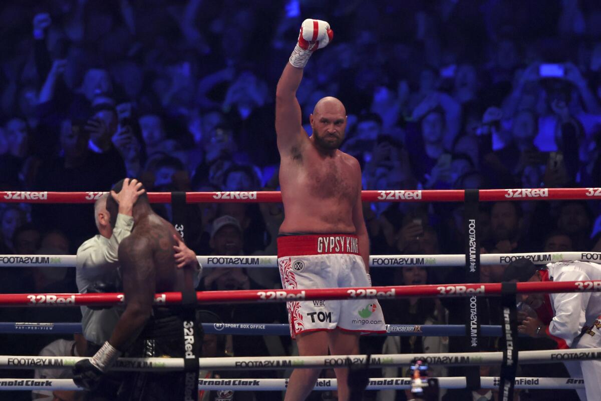 World heavyweight champion Tyson Fury celebrates after beating Dillian Whyte to retain his WBC title April 23, 2022.