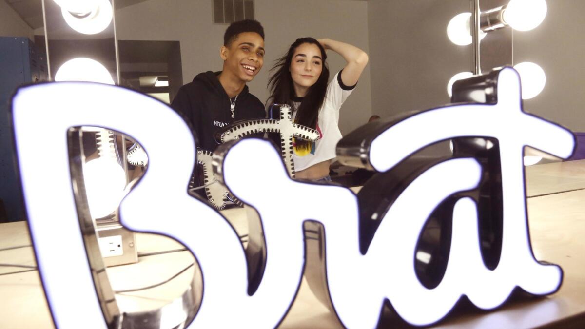 Actor Bryce Xavier, 16, left, of the Brat show "Total Eclipse," and actress Indiana Massara, 15, of "Chicken Girls," in the makeup room at the digital video company Brat in Los Angeles.