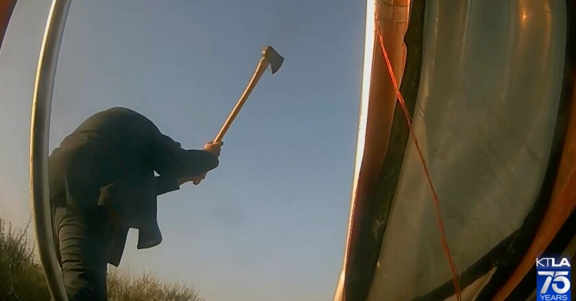 A man swings an ax