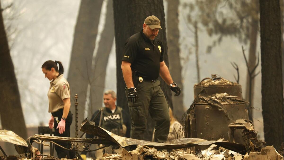 Search crews work in Paradise, Calif., after the Camp fire in November.