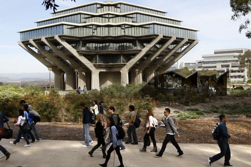 Students at the University of California San Diego walk by the Geisel Library on campus in this 2010 file photo. The university is one of three UC schools to make the Kiplinger top 10 list. U-T