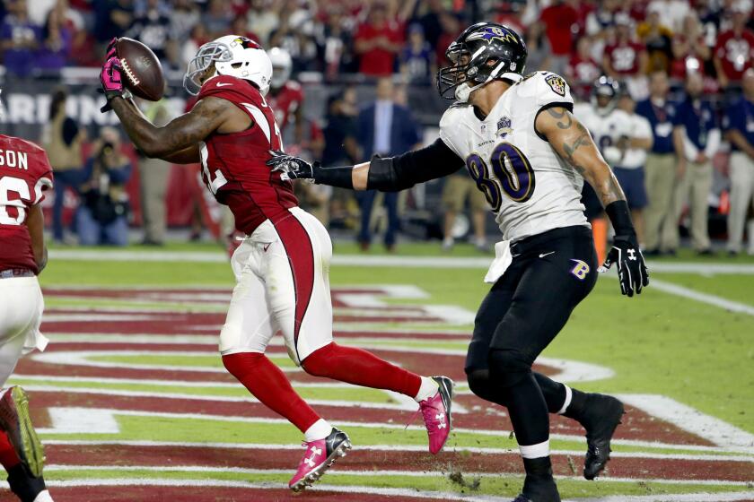Cardinals strong safety Tony Jefferson (22) intercepts a throw intended for Ravens tight end Crockett Gillmore in the end zone during the final seconds. The Cardinals won 26-18.