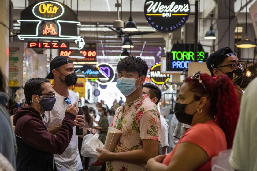 LOS ANGELES, CA - JULY 27, 2021- Visitors to the Grand Central Market are mostly masked on Tuesday, July 27, 2021 in Los Angeles, CA. (Brian van der Brug / Los Angeles Times)