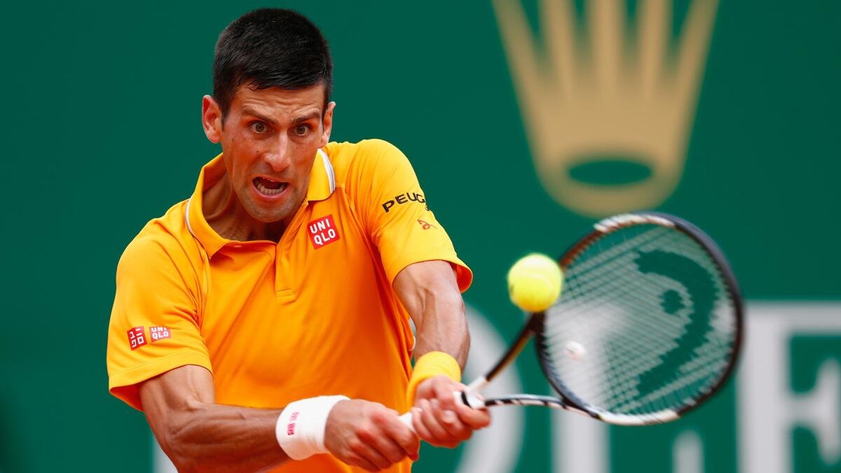 Novak Djokovic plays a return during his victory over Rafael Nadal in the Monte Carlo Masters semifinals in Monaco on Saturday.