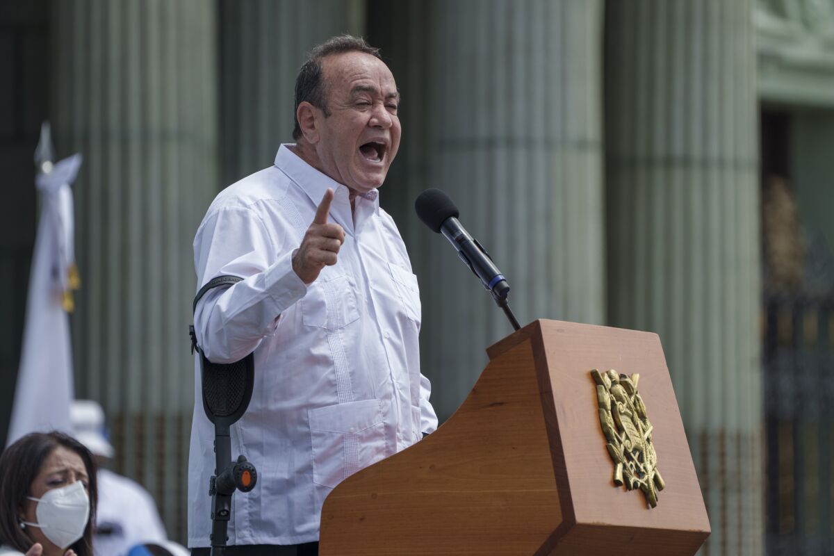 Guatemalan President Alejandro Giammattei speaks during an event celebrating a new law coined "Law for the Protection of Life and Family" in Guatemala City, Wednesday, March 9, 2022. The new law passed by Congress the previous day, on International Women's Day, doubles prison sentences for abortion, stigmatizes the LGBT community and prohibits educating children about sexual diversity. (AP Photo/Moises Castillo)