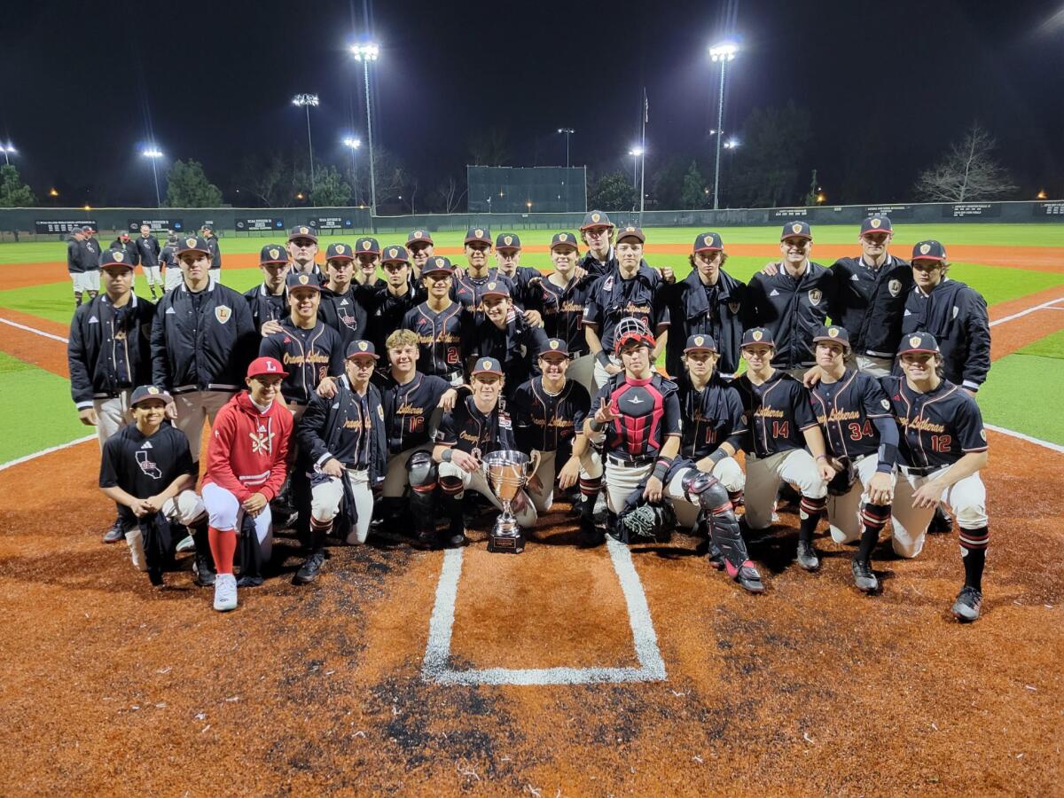 Orange Lutheran players and coaches pose for a team photo.