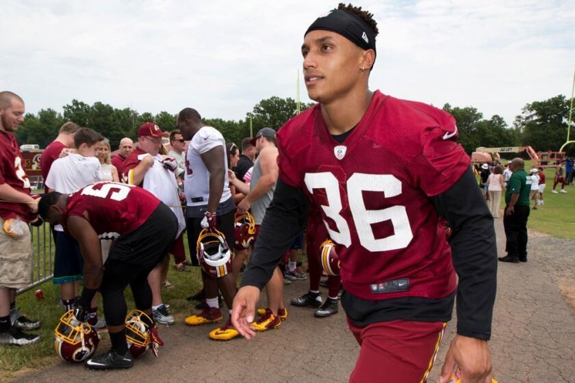 This June 15, 2016 photo shows Washington Redskins' safety Su'a Cravens walking from the field during the NFL football teams minicamp at the Redskins Park in Ashburn, Va. Cravens had to be talked out of retiring on Sunday, Sept. 3, 2017 during a meeting with team president Bruce Allen, and his future with the team is in doubt. (AP Photo/Manuel Balce Ceneta)