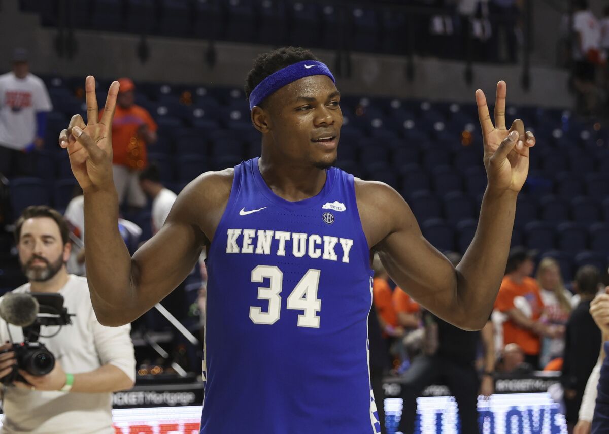 Kentucky forward Oscar Tshiebwe (34) celebrates after an NCAA college basketball game against Florida, Saturday, March 5, 2022, in Gainesville, Fla. (AP Photo/Matt Stamey)