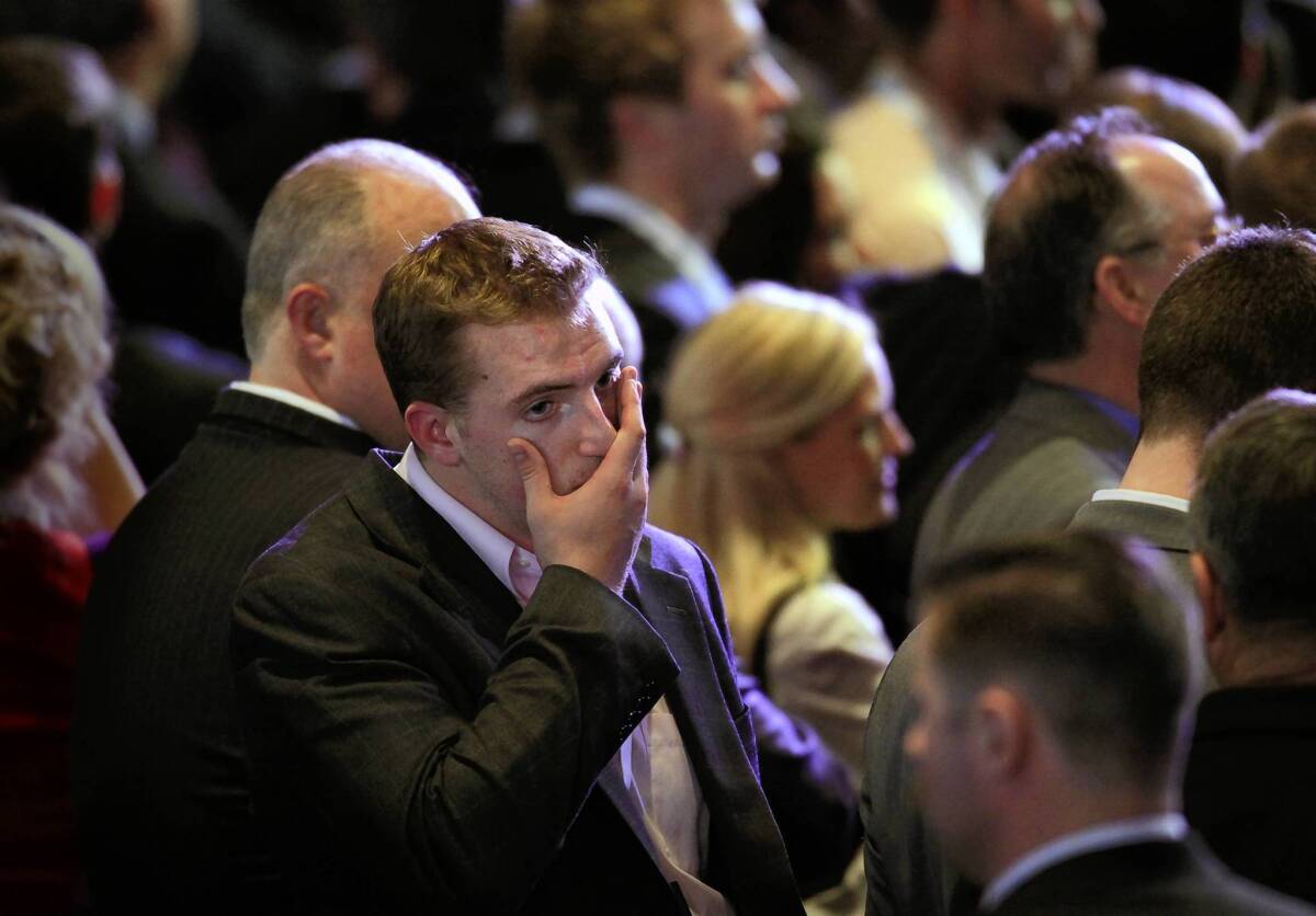 A dismayed Republican crowd reacts at the Boston Convention Center on election night as the race is called for President Obama.