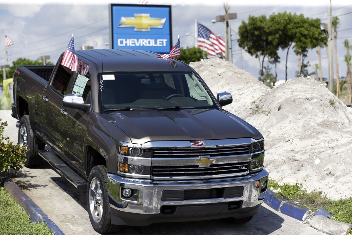 Strong sales of pickups like this Chevrolet Silverado helped boost General Motors.