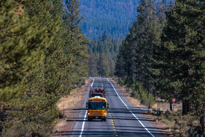 SUSANVILLE, CA - SEPTEMBER 28: Lassen High School volleyball team travels in diesel school bus on Highway 44 for a volleyball match 119 miles away at Valley Early College High School in Cottonwood on Thursday, Sept. 28, 2023 in Susanville, CA. (Irfan Khan / Los Angeles Times)