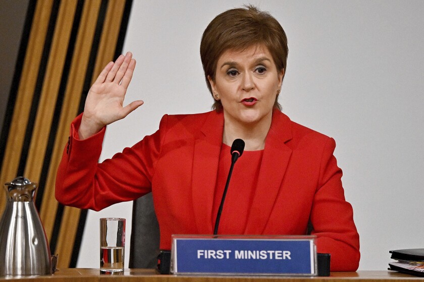 First Minister of Scotland Nicola Sturgeon takes the oath before giving evidence to the Committee on the Scottish Government Handling of Harassment Complaints, at Holyrood in Edinburgh, Scotland, Wednesday March 3, 2021. The inquiry is investigating the government’s handling of sexual harassment allegations against former leader Alex Salmond, and allegations that Sturgeon misled parliament. (Jeff J Mitchell/PA via AP)