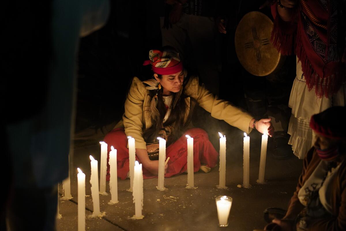 A woman takes part in a ceremony Friday marking the 500th anniversary of the fall in 1521 of the Aztec capital.