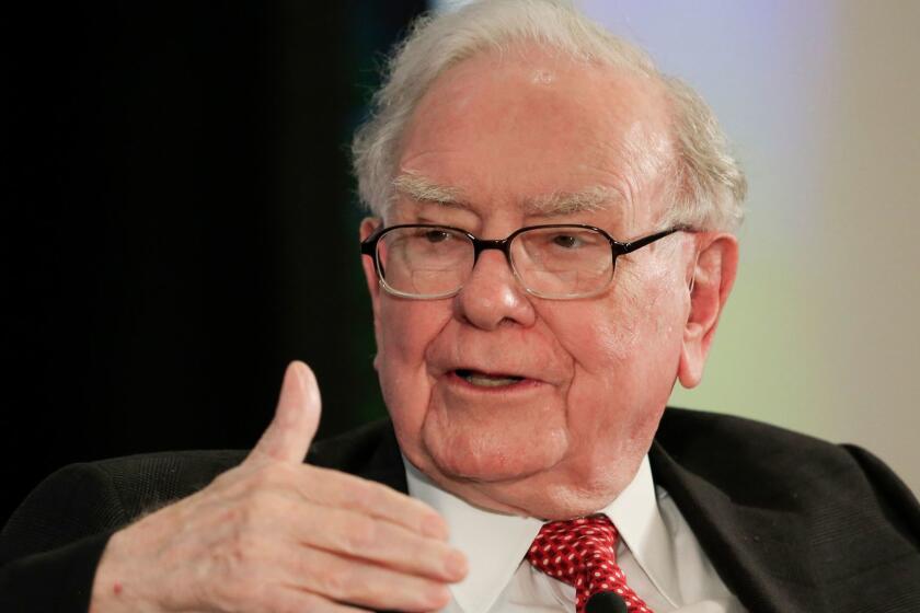 FILE - In this Oct. 3, 2017, file photo, investor Warren Buffett gestures on stage at a national conference sponsored by the Purpose Built Communities group that Buffett supports, in Omaha, Neb. Buffett appeared on CNBC Monday, Feb. 26, 2018, after releasing his annual letter to Berkshire Hathaway shareholders on Saturday. (AP Photo/Nati Harnik, File)